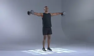 Man utför axelövning med hantel.