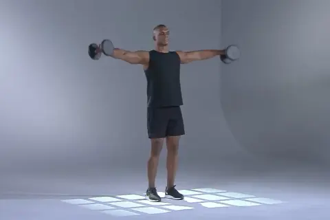 Man utför axelövning med hantel.