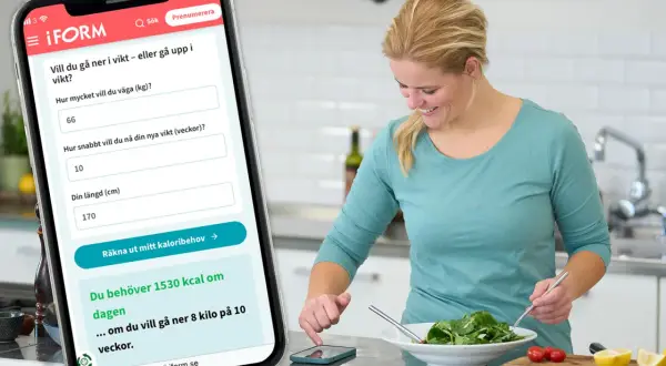Kvinna använder app för att räkna ut sitt kaloribehov. Appen visar 1530 kcal/dag för viktnedgång, men inte hur mycket kolhydrater per dag.